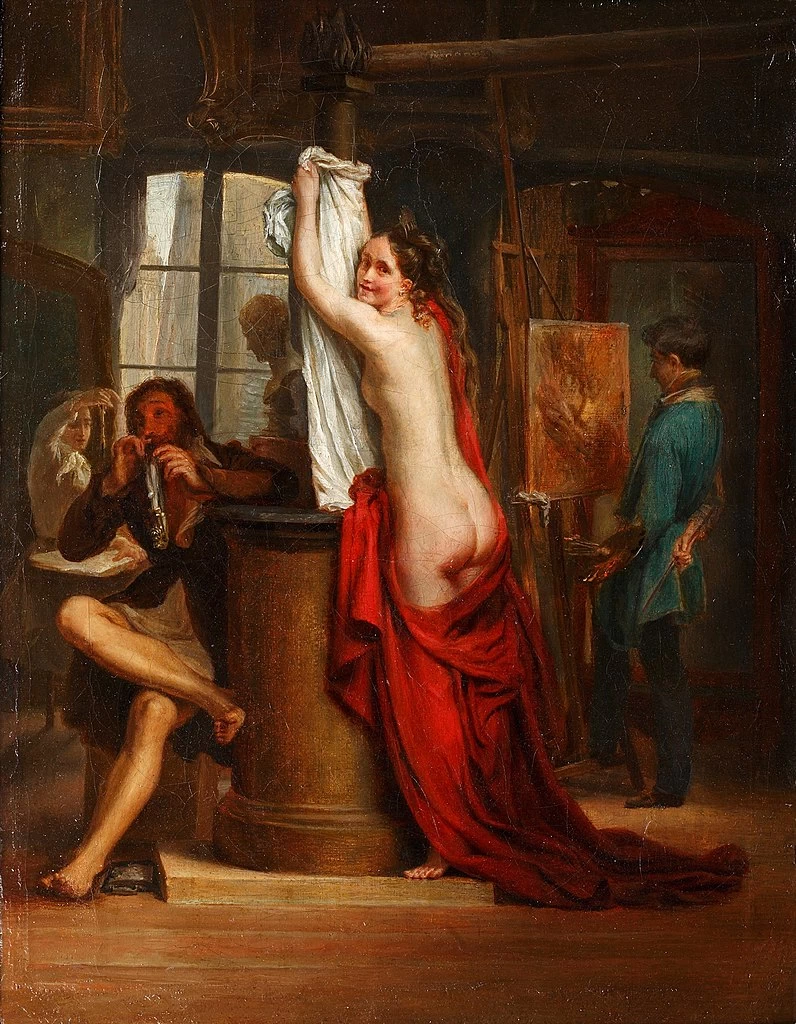Una modella nuda nello studio di un artista